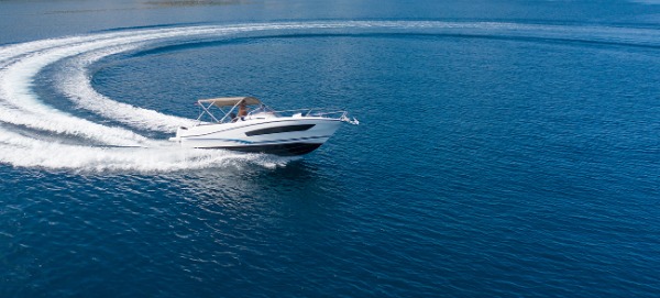 Man on a boat on a lake.