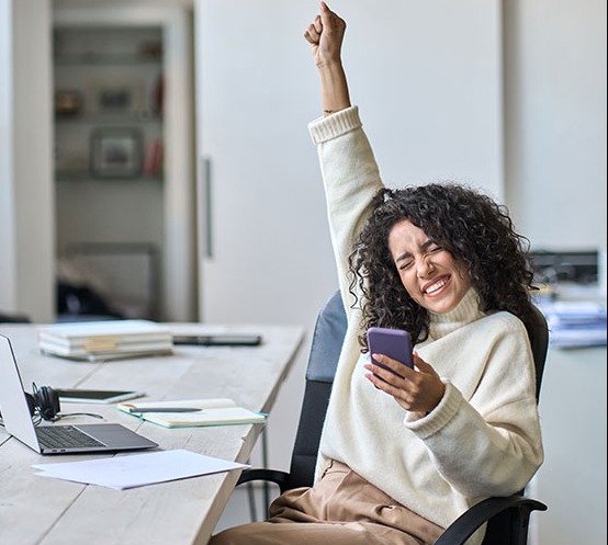 Woman raising her hand in excitement.