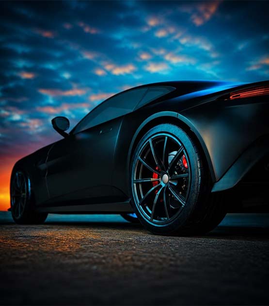 Car riding off into the sunset.