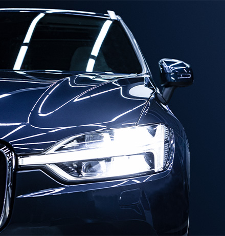 Blue car facing forward.